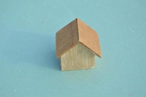 Model of a wooden house as a family property photo