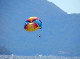 Parachuting over the sea, parasailing photo