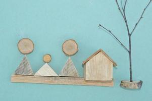 Wooden model of a house and family photo