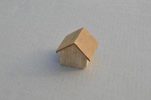 Model of a wooden house as a family property photo