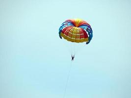 Parachuting over the sea, parasailing photo