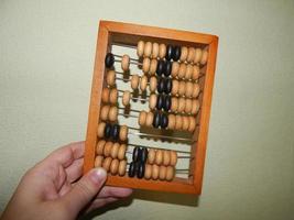 Manual mechanical abacus for accounting and financial calculations photo