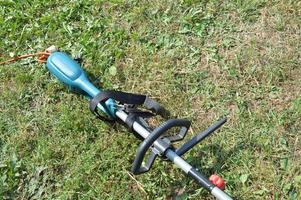Trimmer and its parts for mowing grass photo