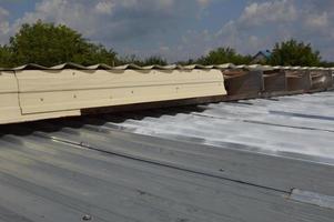 Roof painting with enamel paint from an aerosol can photo