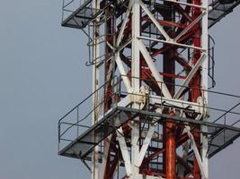 Levels on the platform of a tower crane with ladders and a railing photo
