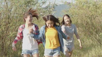 Group of a young Asian woman with friends happy camping in nature having fun. video