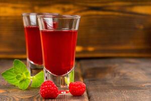 homemade raspberry liqueur with mint