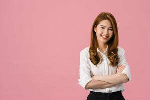 Portrait of young Asia lady with positive expression, arms crossed, smile broadly, dressed in casual clothing and looking at camera over pink background. Happy adorable glad woman rejoices success. photo