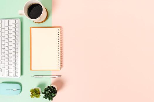 Creative flat lay photo of workspace desk. Top view office desk with keyboard, mouse and open mockup black notebook on pastel green pink color background. Top view mock up with copy space photography.