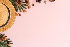 Creative flat lay photo of travel vacation spring or summer tropical fashion. Top view beach accessories on pastel pink color background with blank space for text. Top view copy space photography.