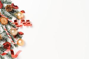 Minimal creative flat lay of christmas traditional composition and new year holiday season. Top view winter christmas decorations on white background with blank space for text. Copy space photography. photo