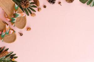 Creative flat lay photo of travel vacation spring or summer tropical fashion. Top view beach accessories on pastel pink color background with blank space for text. Top view copy space photography.