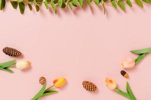 Creative flat lay photo of travel vacation spring or summer tropical fashion. Top view beach accessories on pastel pink color background with blank space for text. Top view copy space photography.