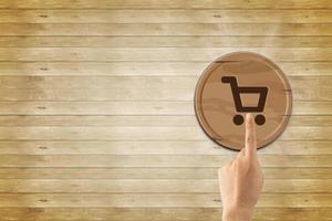 cart icon, sale volume increase make business grow, Online shopping to wood cart on background and space, sale volume increase make business success, and shopping cart symbol photo