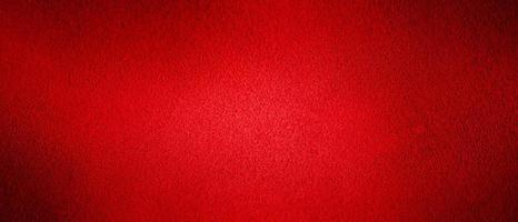 Red background natural suede with a dark edge and a light center. Horizontal web banner. photo