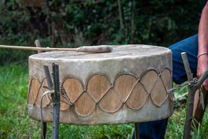 North American Indian drum made of rawhide with bat ready to play photo