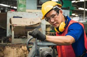 Asian Industrial workers are working on projects in large industrial plants with many devices. photo