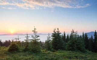 Sunset in the mountains landscape. Dramatic sky. Carpathian of Ukraine Europe photo