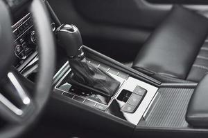 Detail of modern car interior, gear stick, automatic transmission in expensive car. photo