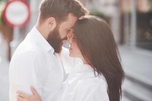 Beautiful happy couple hugging on the city street.Lifestyle concept love and romance photo