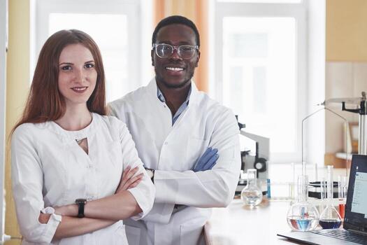 Laboratory laboratories conduct experiments in a chemical laboratory in transparent flasks. Output formulas photo