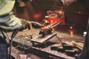 Industrial factory weld worker. Welding or welder master weld the steel photo