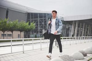 photo of a young man before an exciting trip at the airport.