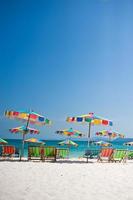 Beach chair under the umbrella of colorful on the beach Phuket, Thailand photo