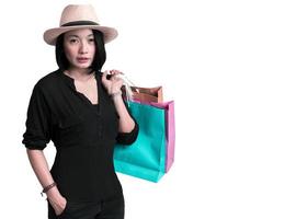 Woman holding shopping bag on white background photo