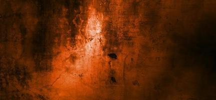 Orange wall with dark shadows. Dark orange cement for the background photo