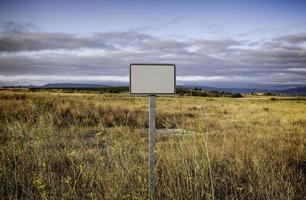 Blank sign in the field photo