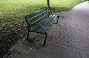 Wooden bench in the park photo