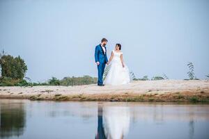 Asian bride and Caucasian groom have romance time and happy together photo