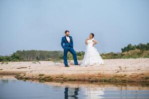 Asian bride and Caucasian groom have romance time and happy together photo