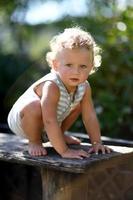 Beautiful baby boy in child garden posing photographer photo