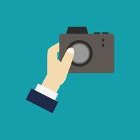 Camera in hand vector