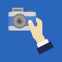 Camera in hand vector