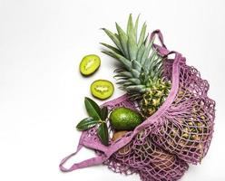 Mesh shopping bag with fruits photo