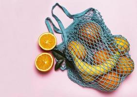 Mesh shopping bag with fruits photo