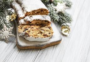 Christmas stollen on wooden background photo