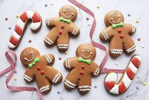 Christmas gingerbread cookies on white marble background photo