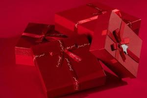 Red gift boxes on a red background photo