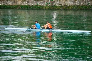 People rowing on the Bilbao River, Basque country, Spain photo