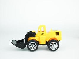 Toy bulldozer on white background, Engineering construction concept photo