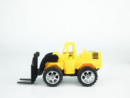 Toy Forklift on white background, Engineering construction concept. photo