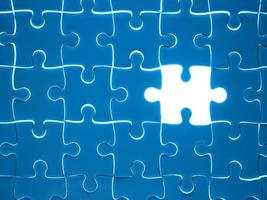 Missing Jigsaw puzzle piece with lighting, business concept for completing the finishing puzzle piece photo