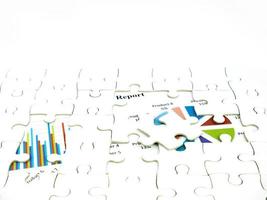 Missing jigsaw puzzle pieces on Graph Calculations background, Key for Business economic success concept photo