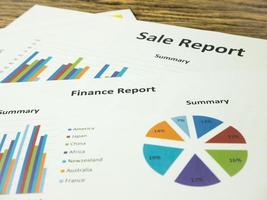 Marketing report with Graph Calculations, savings, finances and economy concept photo