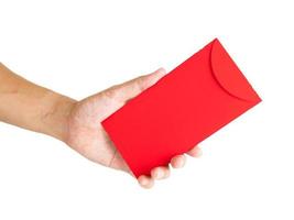 Man's Hand hold with Red envelope isolated on white background for gift Chinese New Year. photo