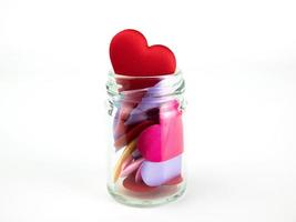 Jar with Colorful mini hearts isolated on white background, Valentine decorations, Various hearts photo